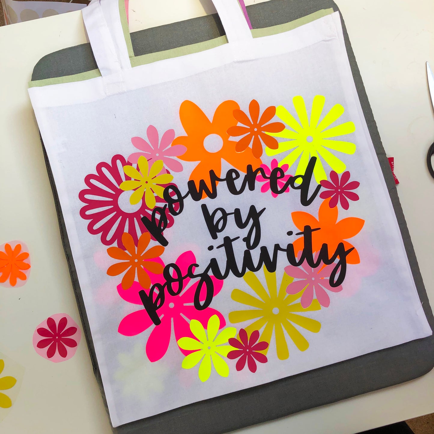 POWERED BY POSITIVITY tote bag